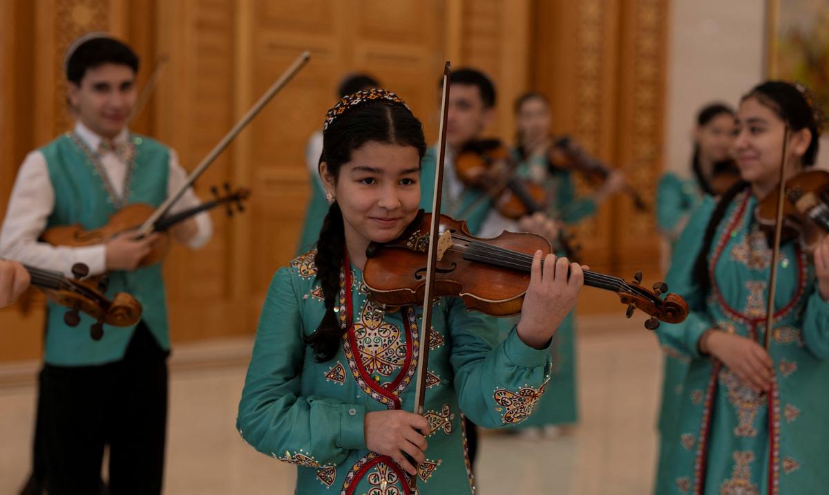 School children perform at a trade fair in Ashgabat, Turkmenistan, March 17, 2026. REUTERS/Umit Bektas