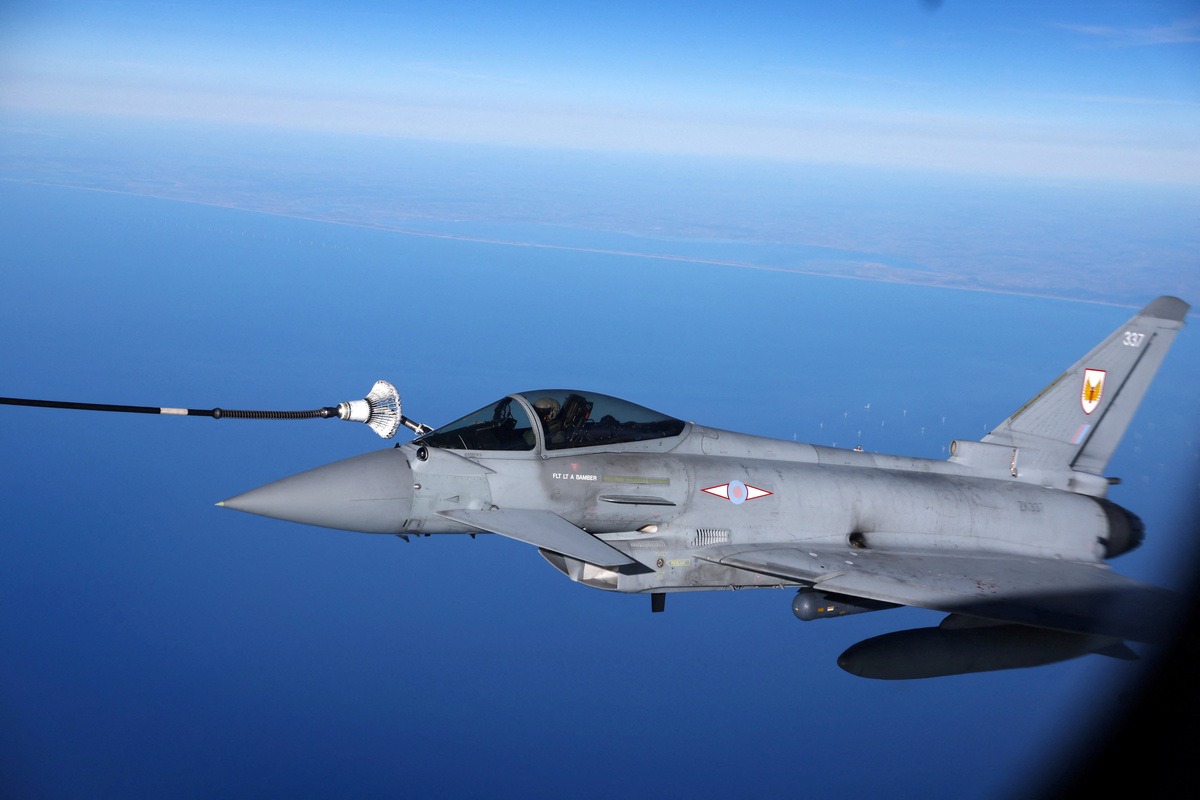 FILE PHOTO: FILE PHOTO: A British Eurofighter jet is refuelled by a Multinational MRTT Unit in the air during NATO's Ramstein Flag exercise above Denmark, starting from Eindhoven Netherlands, Denmark April 2, 2025. REUTERS/Piroschka van de Wouw/File Photo