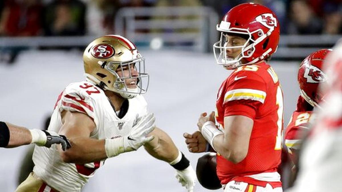 San Francisco 49ers’ Nick Bosa, left, forces Kansas City Chiefs quarterback Patrick Mahomes to fumble, which Mahomes recovered, during the second half of the NFL Super Bowl 54 football game Sunday, Feb. 2, 2020, in Miami Gardens, Fla.
