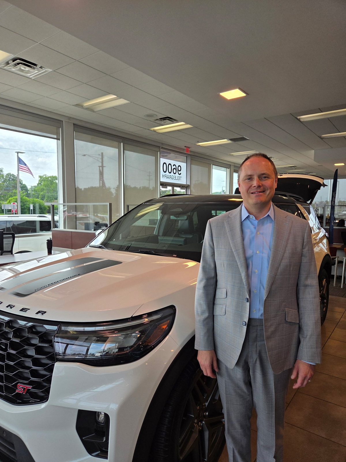 Brian Godfrey, dealer owner of Pat Millikin Ford in Redford in the showroom at Pat Millikin Ford on June 30, 2026.