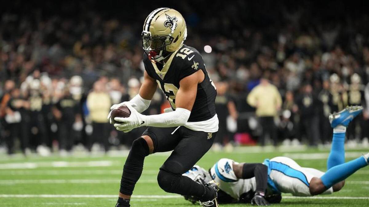  New Orleans Saints wide receiver Chris Olave (12) scores a touchdown in the fourth quarter against the Carolina Panthers at Caesars Superdome. | Matthew Hinton-Imagn Images 