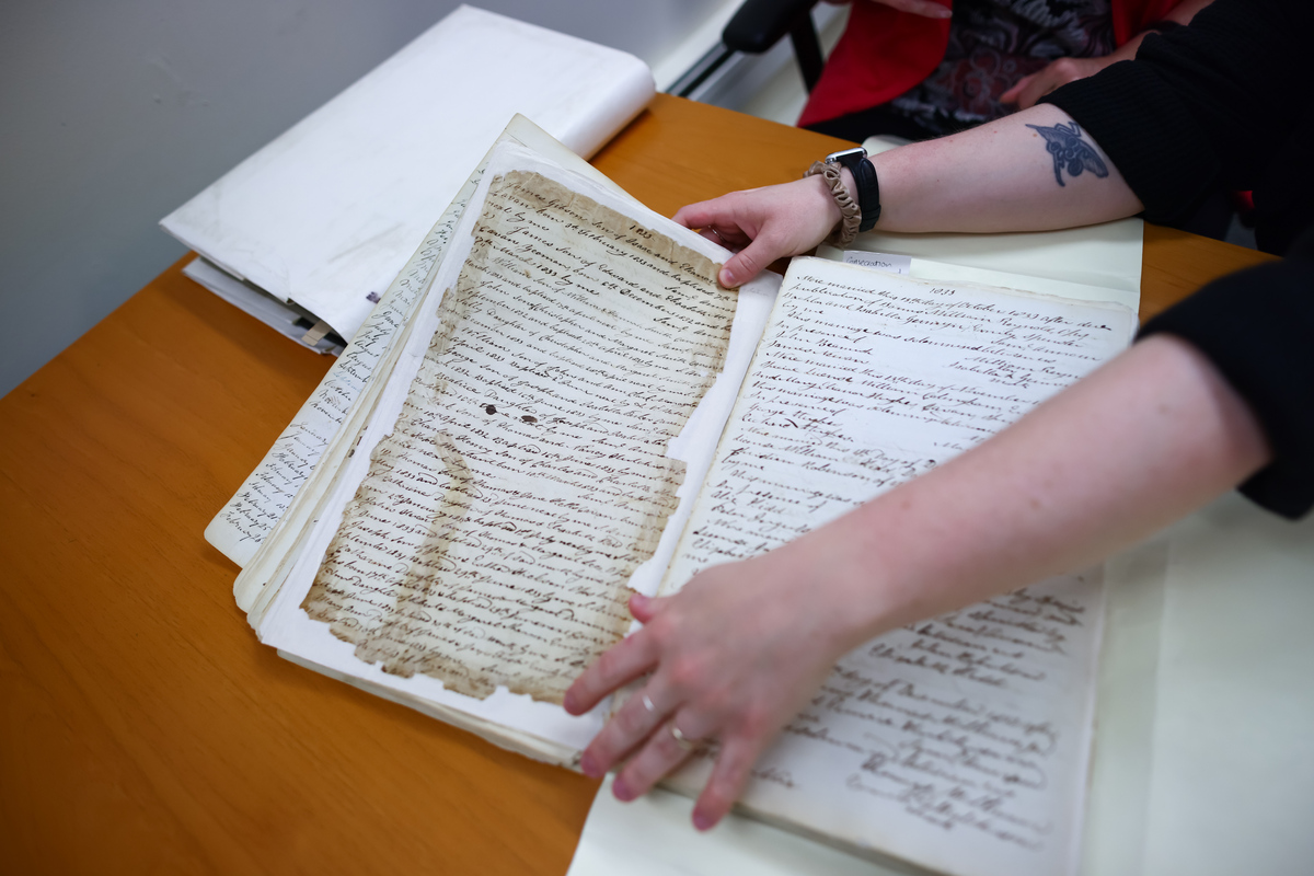 A parish register at the Anglican Diocese of Toronto's archive in Toronto, Ontario, Canada on June 8, 2026. Six months after Canada expanded its citizenship eligibility, requests are flooding in for archival records. The documents are vital for proving ties to the country. (Cole Burston/The New York Times)
