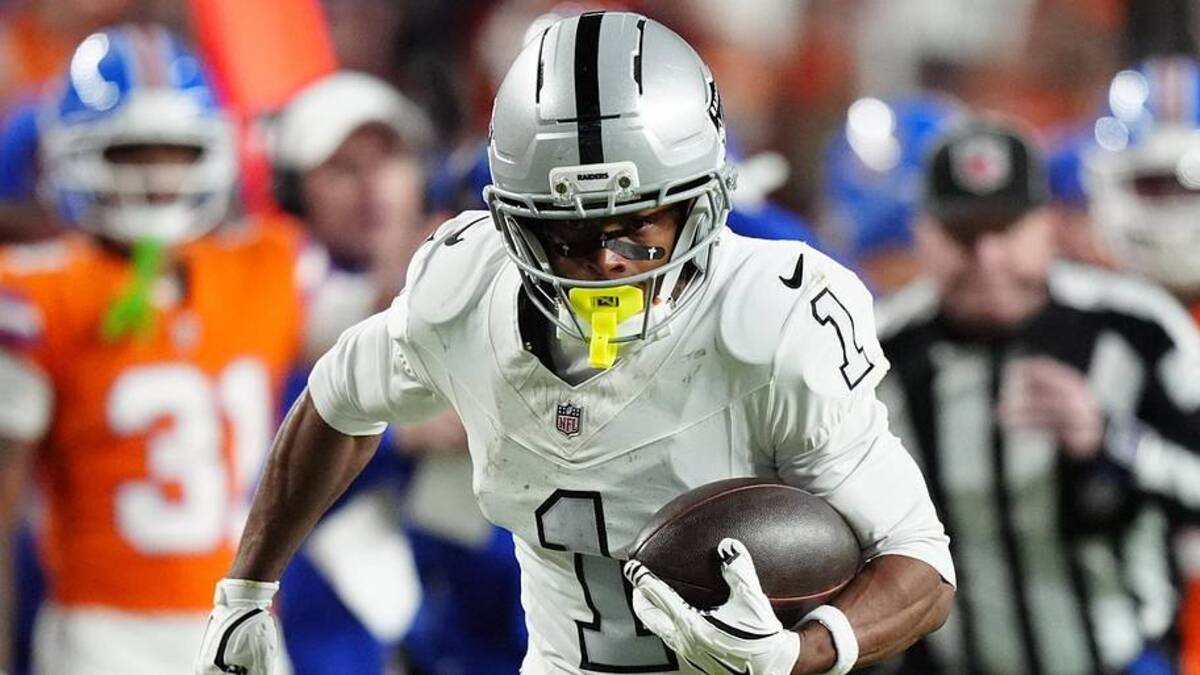  Nov 6, 2025; Denver, Colorado, USA; Las Vegas Raiders wide receiver Tre Tucker (1) runs with the ball after catch against the Denver Broncos during the first half at Empower Field at Mile High. Mandatory Credit: Ron Chenoy-Imagn Images | Ron Chenoy-Imagn Images 