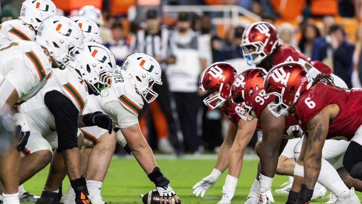  Jan 19, 2026; Miami Gardens, FL, USA; General view down the line of scrimmage as Miami Hurricanes offensive lineman James Brockermeyer (52) prepares to snap the ball against the Indiana Hoosiers during the College Football Playoff National Championship game at Hard Rock Stadium. Mandatory Credit: Mark J. Rebilas-Imagn Images | Mark J. Rebilas-Imagn Images 