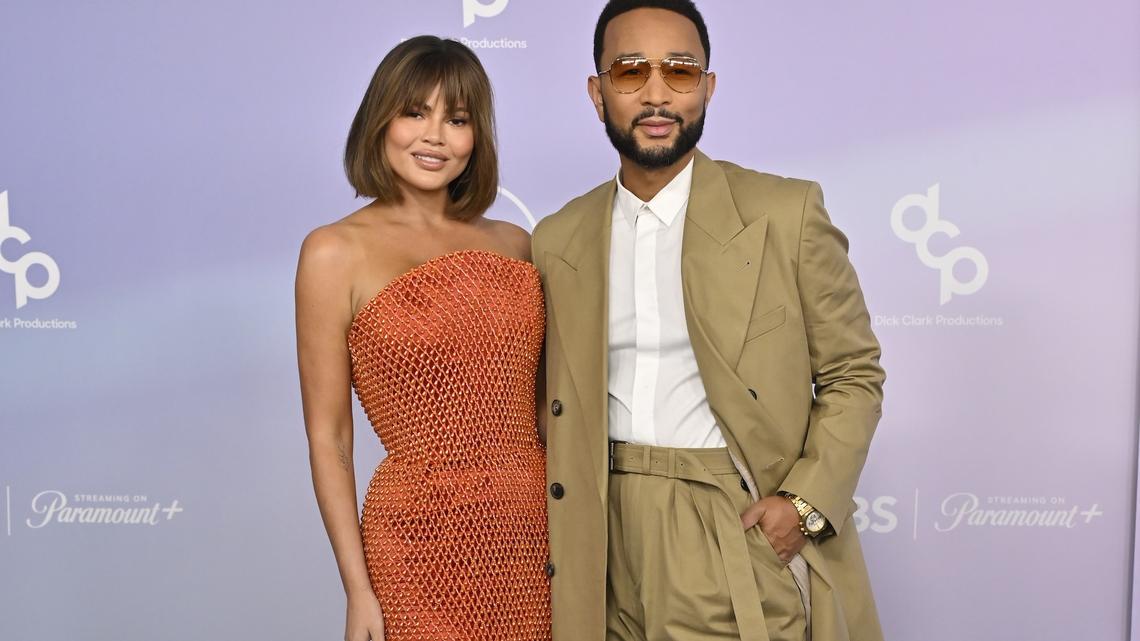 John Legend Saves Chrissy Teigen From Wardrobe Malfunction at 2026 AMAs 