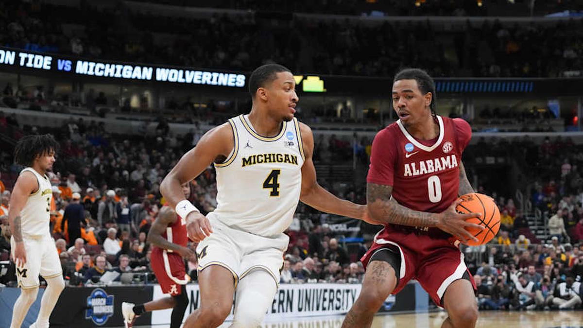  Mar 27, 2026; Chicago, IL, USA; Alabama Crimson Tide guard Labaron Philon Jr. (0) drives the ball while defended by Michigan Wolverines guard Nimari Burnett (4) in the second half during a Sweet Sixteen game of the Midwest Regional of the men's 2026 NCAA Tournament at United Center. Mandatory Credit: David Banks-Imagn Images | David Banks-Imagn Images 