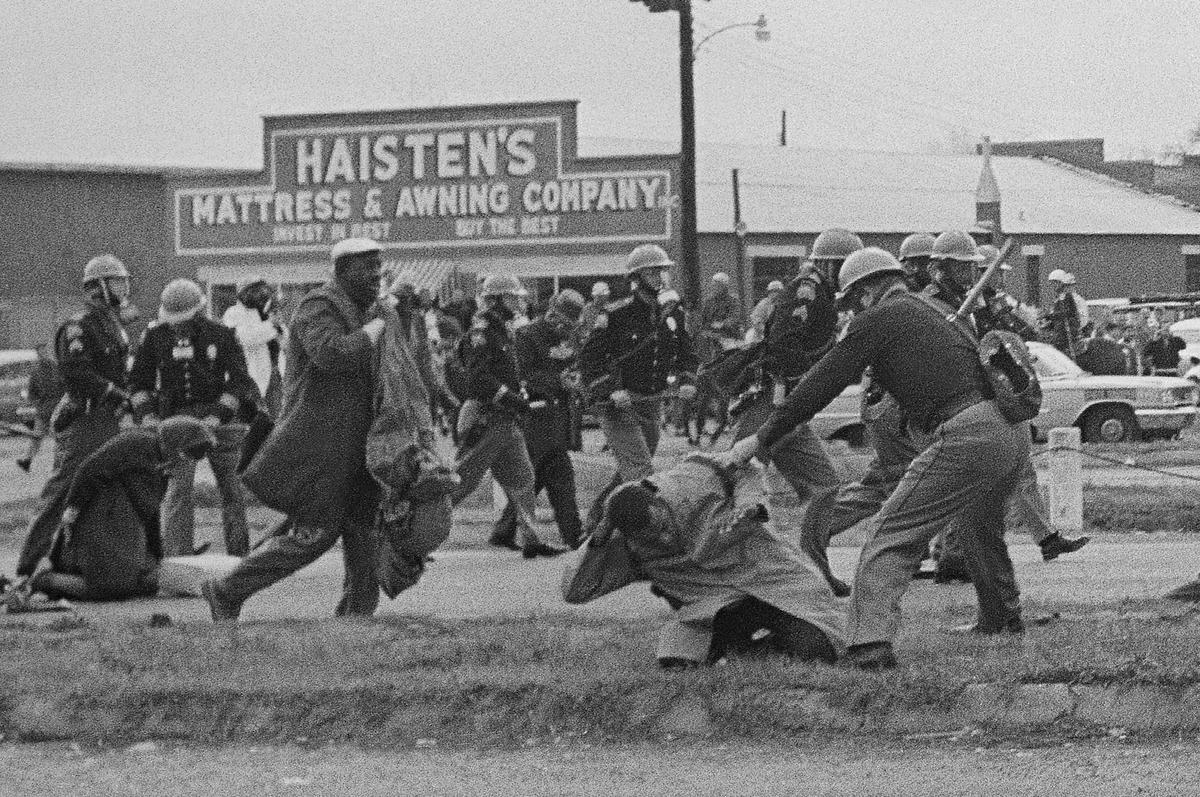  State troopers in Selma, Ala., swing billy clubs on March 7, 1965, to break up a march by advocates for Black Americans' voting rights. AP Photo, File 
