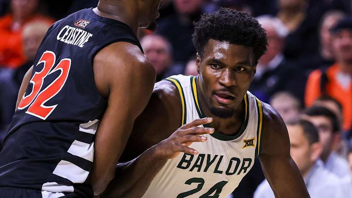  Jan 28, 2026; Cincinnati, Ohio, USA; Baylor Bears guard Tounde Yessoufou (24) dribbles against Cincinnati Bearcats forward Jalen Celestine (32) in the second half at Fifth Third Arena. Mandatory Credit: Katie Stratman-Imagn Images | Katie Stratman-Imagn Images 