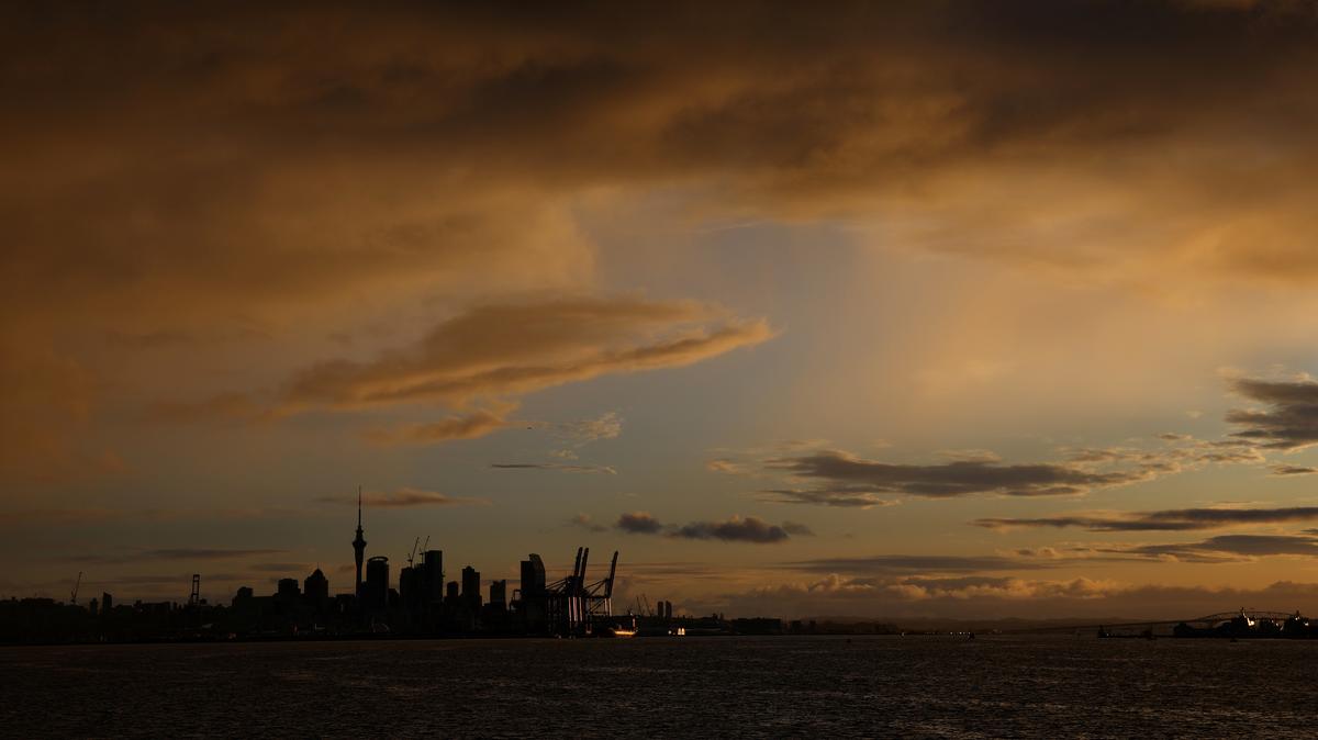 The Auckland skyline is seen at sunset, New Zealand, August 12, 2023. REUTERS/Molly Darlington