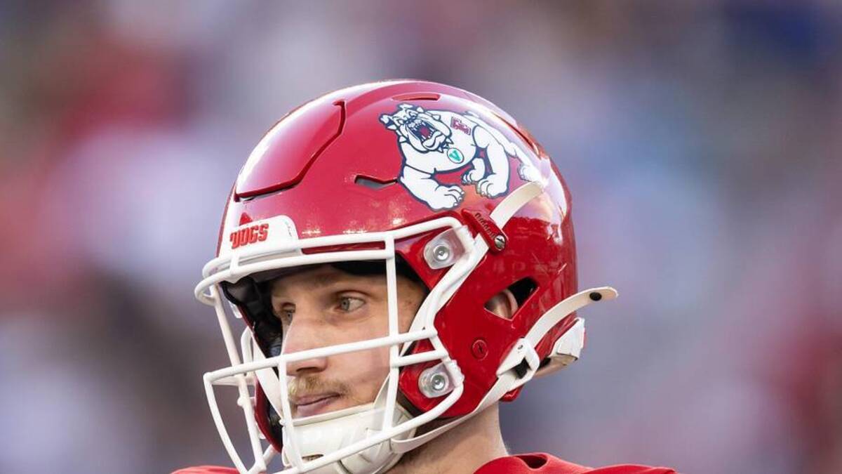  Dec 27, 2025; Tucson, AZ, USA; Fresno State Bulldogs quarterback E.J. Warner (13) against the Miami (OH) RedHawks during the Snoop Dogg Arizona Bowl at Casino Del Sol Stadium. Mandatory Credit: Mark J. Rebilas-Imagn Images | Mark J. Rebilas-Imagn Images 