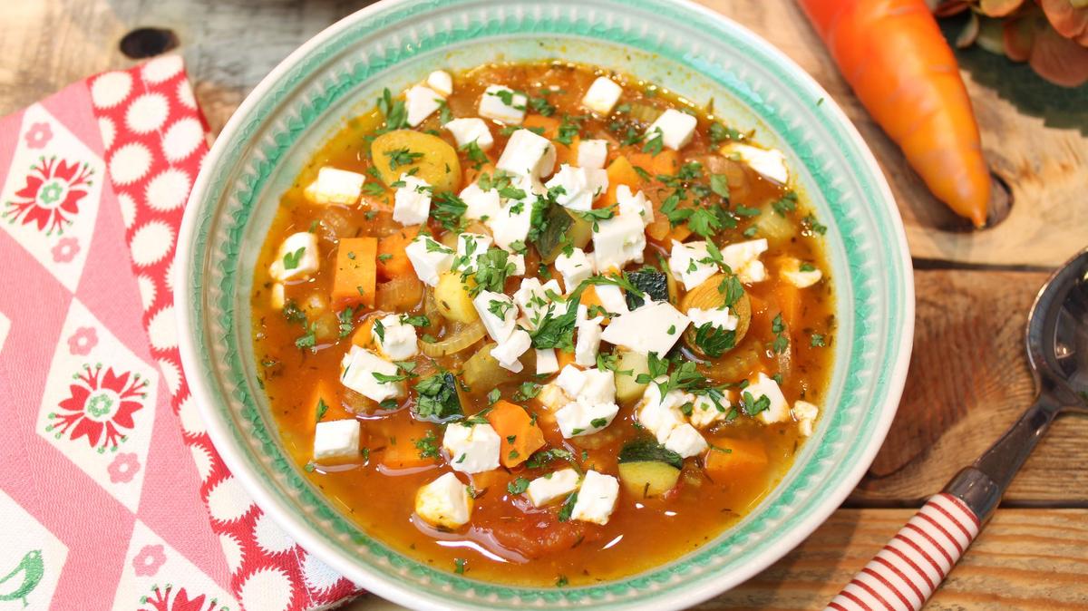 Greek vegetable soup doesn't only have courgettes, carrots and other veggies in it but a nice portion of the country's famous cheese: Feta.