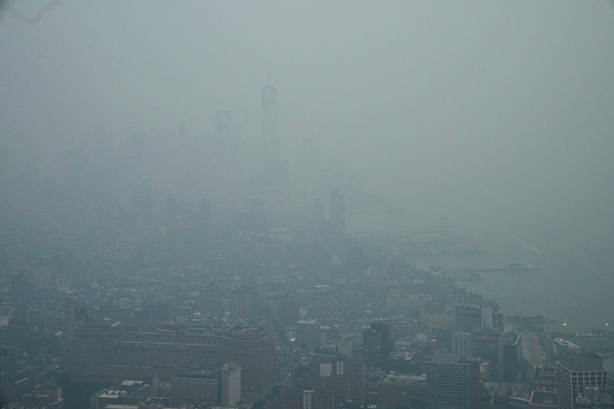 The New York City skyline and the One World Trade Center are seen from the Edge observation deck through a cover of wildfire smoke in New York City, U.S., July 16, 2026. REUTERS/Eduardo Munoz