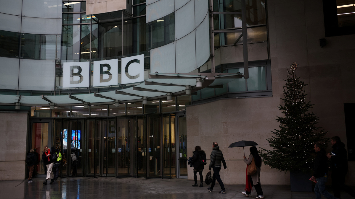 People walk outside the BBC Broadcasting House, after U.S. President Donald Trump sued the BBC for up to $10 billion in damages over edited clips of a speech, in London, Britain, December 16, 2025. REUTERS/Isabel Infantes