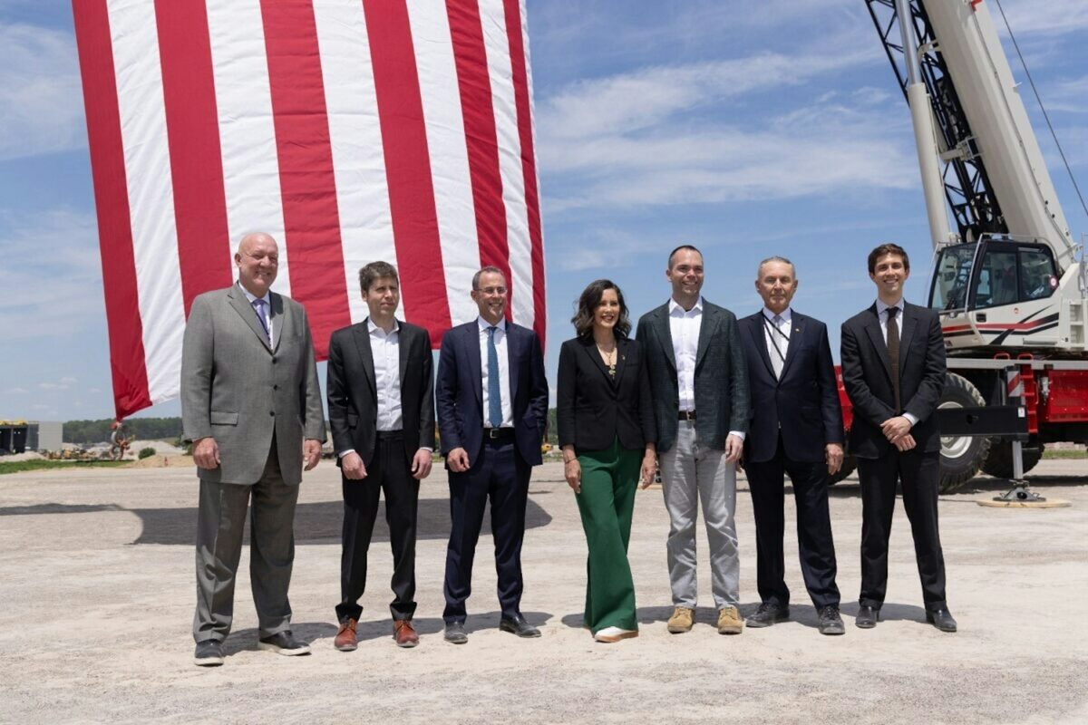  Michigan Gov. Gretchen Whitmer, center, has been criticized for participating in this photo op at the construction site for a new data center in her state. Related Digital via Planet Detroit 