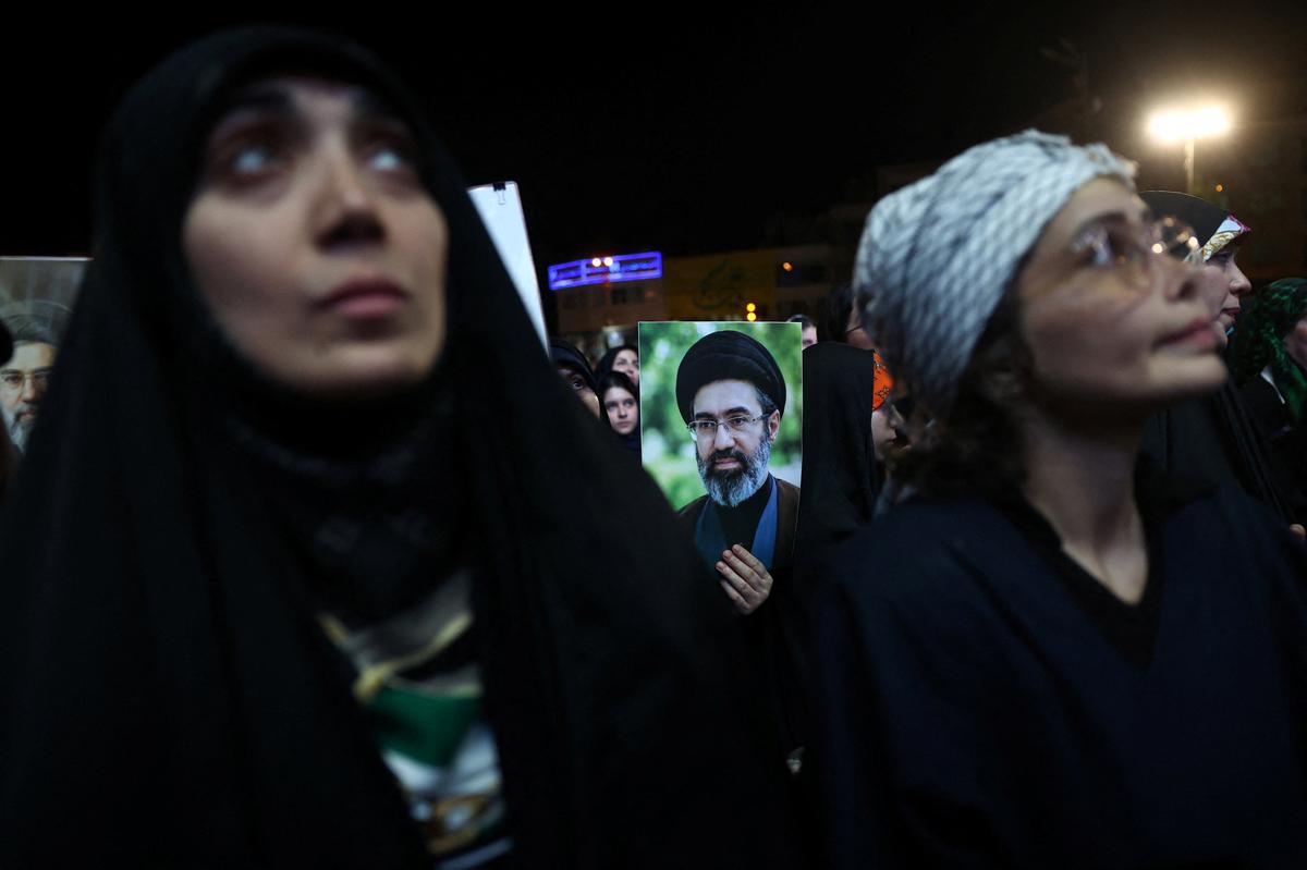 A woman holds an image of Iran's Supreme Leader Mojtaba Khamenei, during a rally in Tehran, Iran, June 1, 2026. Majid Asgaripour/WANA (West Asia News Agency) via REUTERS