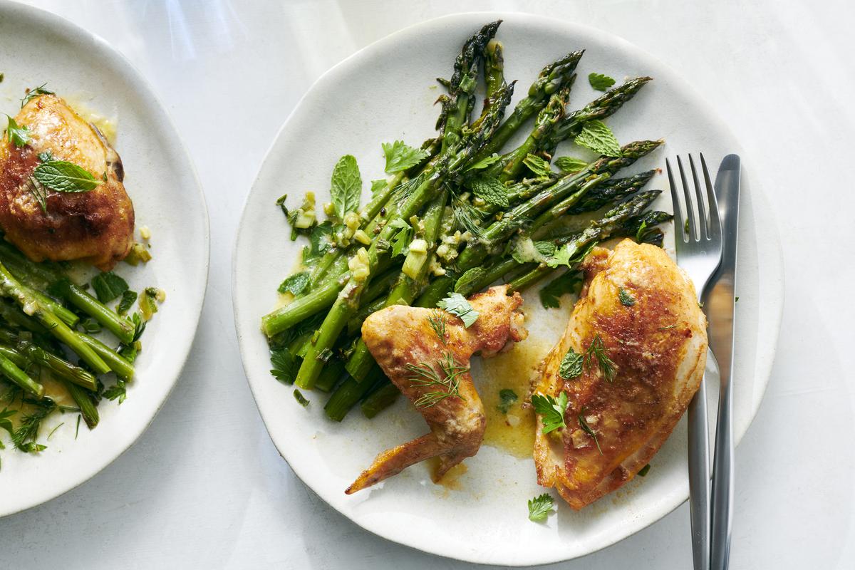 Lemon chicken with asparagus. Roasting a cut-up chicken with bunches of asparagus and scallions makes for an easy, savory meal that doesn't stint on vegetables. Food styled by Hadas Smirnoff. (David Malosh/The New York Times)