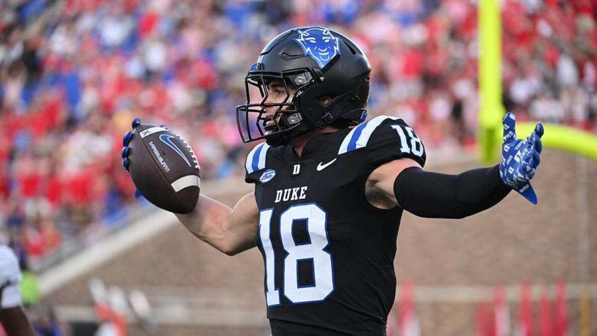  Sep 20, 2025; Durham, North Carolina, USA; Duke Blue Devils wide receiver Cooper Barkate (18) celebrates a touchdown during the third quarter against the NC State Wolfpack at Wallace Wade Stadium. Mandatory Credit: Zachary Taft-Imagn Images | IMAGN IMAGES via Reuters Connect 