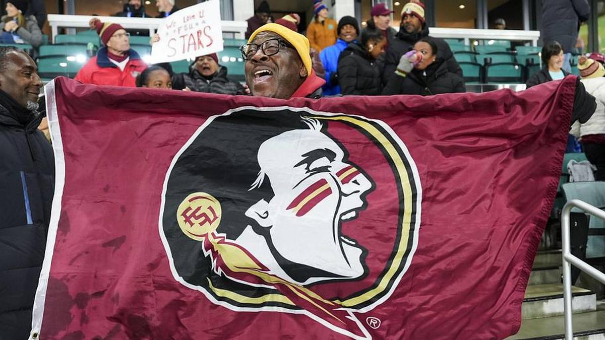  Dec 5, 2025; Kansas City, MO, USA; A Florida State Seminoles fan cheers after defeating the Texas Christian University Horned Frogs in a 2025 NCAA Women's College Cup semifinal match at CPKC Stadium. Mandatory Credit: Jay Biggerstaff-Imagn Images | Jay Biggerstaff-Imagn Images 