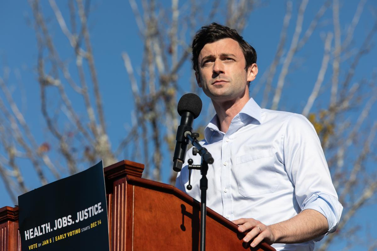  Jon Ossoff speaks to the crowd during an outdoor drive-in rally on December 5, 2020 in Conyers, Georgia. 