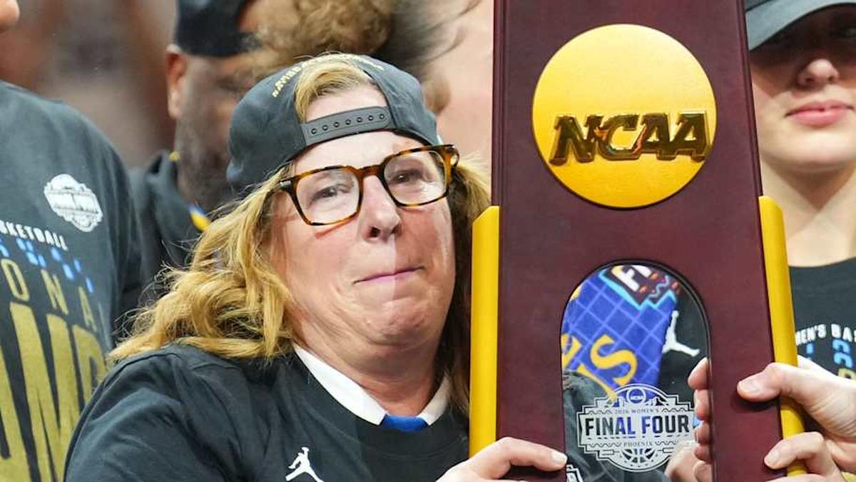  Apr 5, 2026; Phoenix, AZ, USA; UCLA Bruins head coach Cori Close celebrates with the trophy on the podium with teammates after defeating the South Carolina Gamecocks during the National Championship game of the women's 2026 NCAA Tournament at Mortgage Matchup Center. Mandatory Credit: Joe Camporeale-Imagn Images | Joe Camporeale-Imagn Images 
