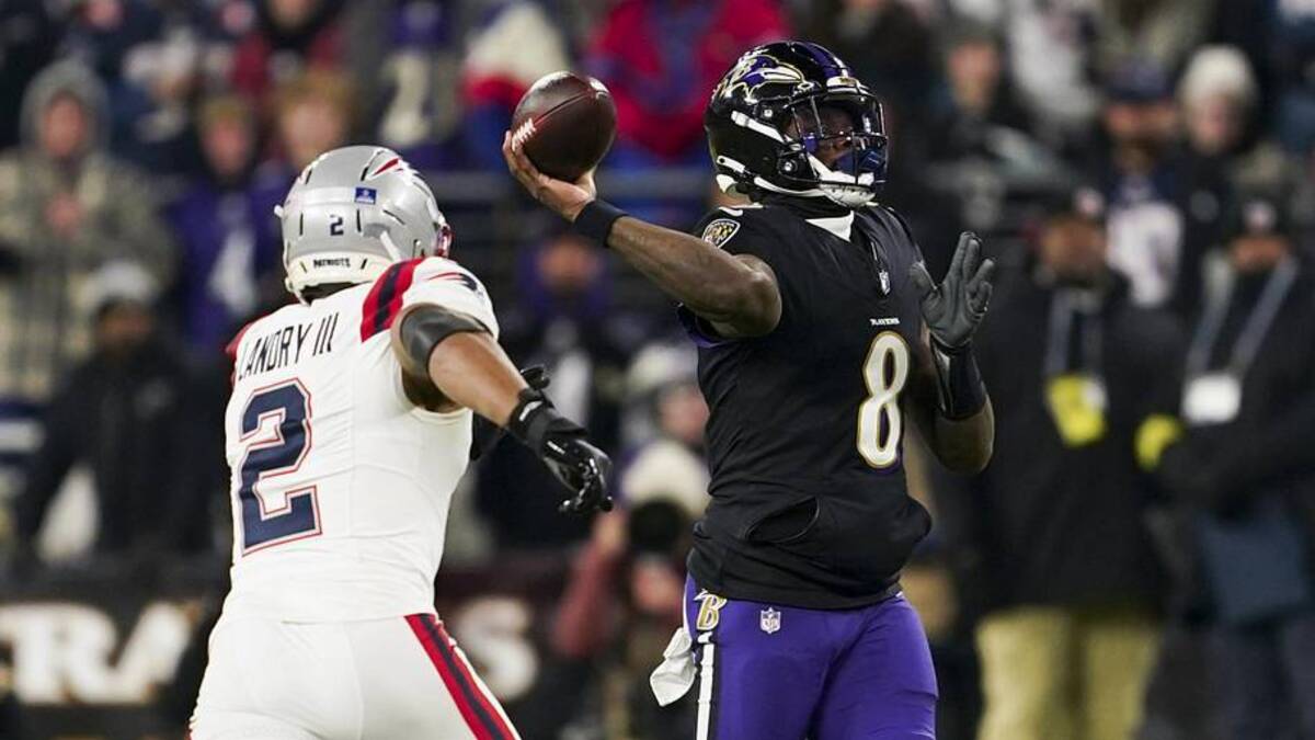  Dec 21, 2025; Baltimore, Maryland, USA; Baltimore Ravens quarterback Lamar Jackson (8) passes against New England Patriots linebacker Harold Landry III (2) during the first half of the game at M&T Bank Stadium. Mandatory Credit: Mitch Stringer-Imagn Images | Mitch Stringer-Imagn Images 