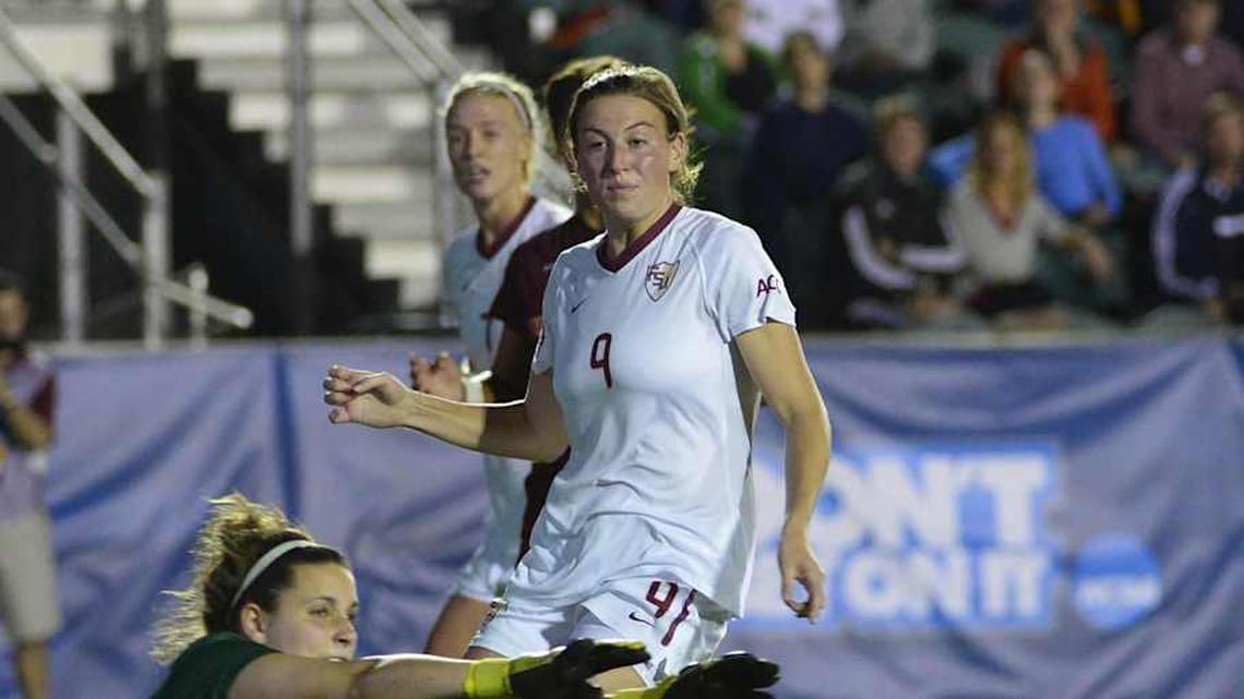  Dec 6, 2013; Cary, NC, USA; Florida State Seminoles forward Kristin Grubka (13) heads the ball into the goal as midfielder Kassey Kallman (9) looks on and Virginia Tech Hokies goalkeeper Dayle Colpitts defends in the first half at WakeMed Soccer Park. Mandatory Credit: Bob Donnan-Imagn Images | Bob Donnan-Imagn Images 
