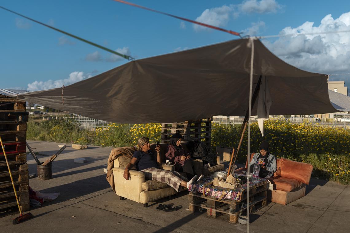 A group of internally displaced people spend the evening under a shelter in Beirut, Lebanon, on Monday, April 20, 2026. The Lebanese president said he had appointed a former ambassador to the United States to lead talks aimed at ending war with Israel and achieving a complete Israeli withdrawal from southern Lebanon. (Diego Ibarra Sánchez/The New York Times)