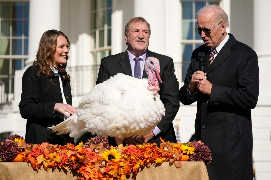 President Joe Biden pardons Chocolate, the national Thanksgiving turkey, at the White House in Washington, Monday, Nov. 21, 2022. Biden is joined by, Ronald Parker, Chairman of the National Turkey Federation, and Alexa Starnes, daughter of the owner of Circle S Ranch. (AP Photo/Andrew Harnik)