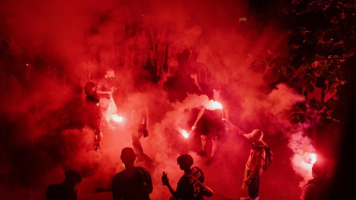 Paris Saint-Germain fans react in Parc des Princes stadium after the team defeated Arsenal in Paris on Saturday. Photo by Valentina Camu/EPA