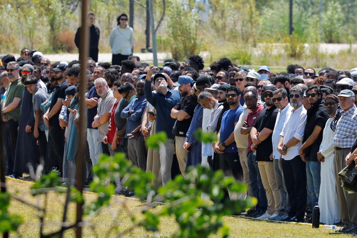 People attend a prayer service for the victims of a shooting at the Islamic Center, in San Diego, California, U.S. May 21, 2026.  REUTERS/Mike Blake