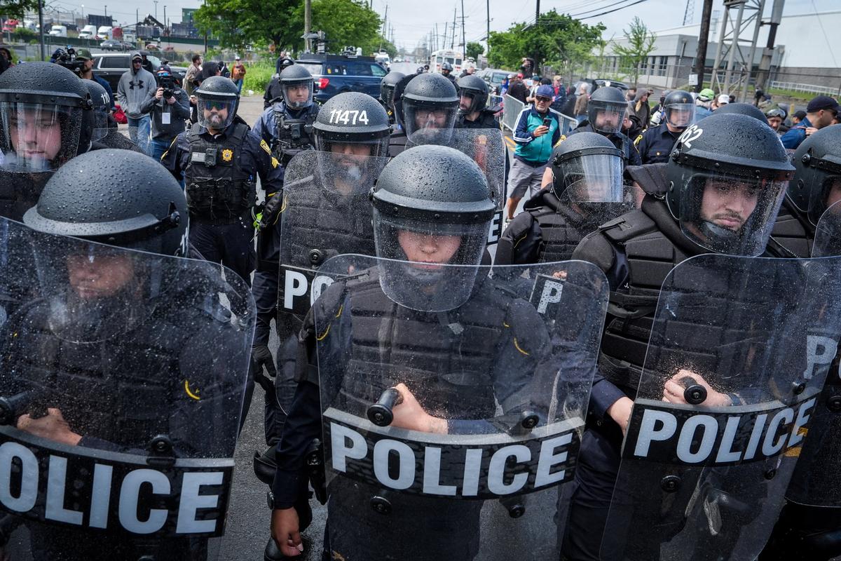 Riot police stand guard as protesters demonstrate outside Delaney Hall in Newark, New Jersey, U.S., May 30, 2026. REUTERS/Ryan Murphy