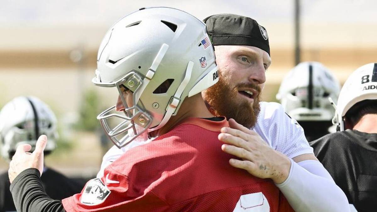  Jun 3, 2026; Henderson, NV, USA; Las Vegas Raiders defensive end Maxx Crosby (98) hugs quarterback Kirk Cousins (8) during organized team activities at Intermountain Health Performance Center. Mandatory Credit: Candice Ward-Imagn Images | Candice Ward-Imagn Images 