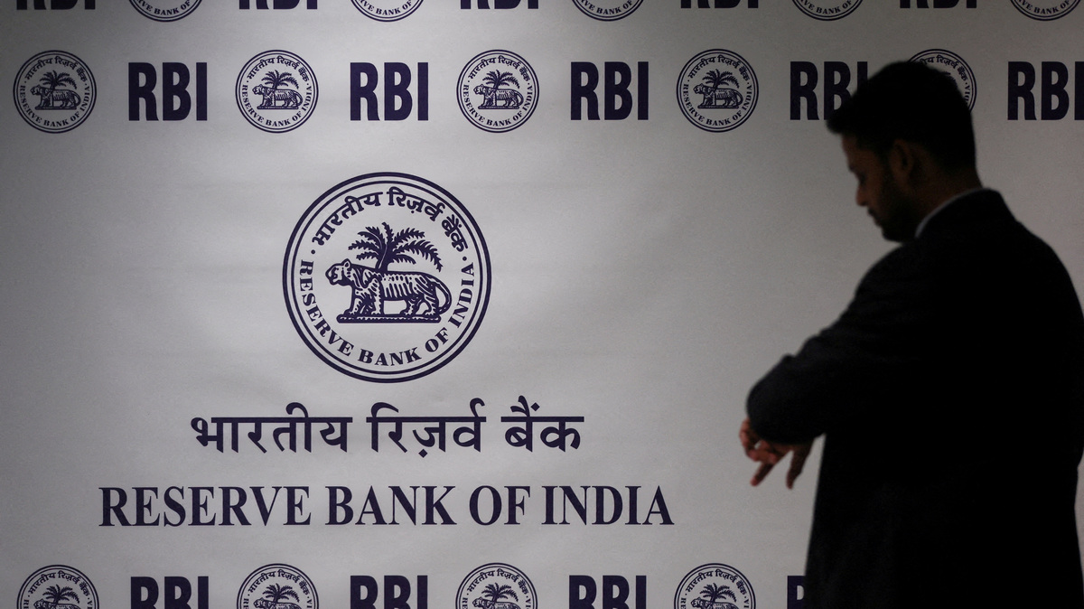 FILE PHOTO: man stands in front of the Reserve Bank of India (RBI) logo inside its headquarters in Mumbai, India, February 6, 2026. REUTERS/Francis Mascarenhas//File Photo