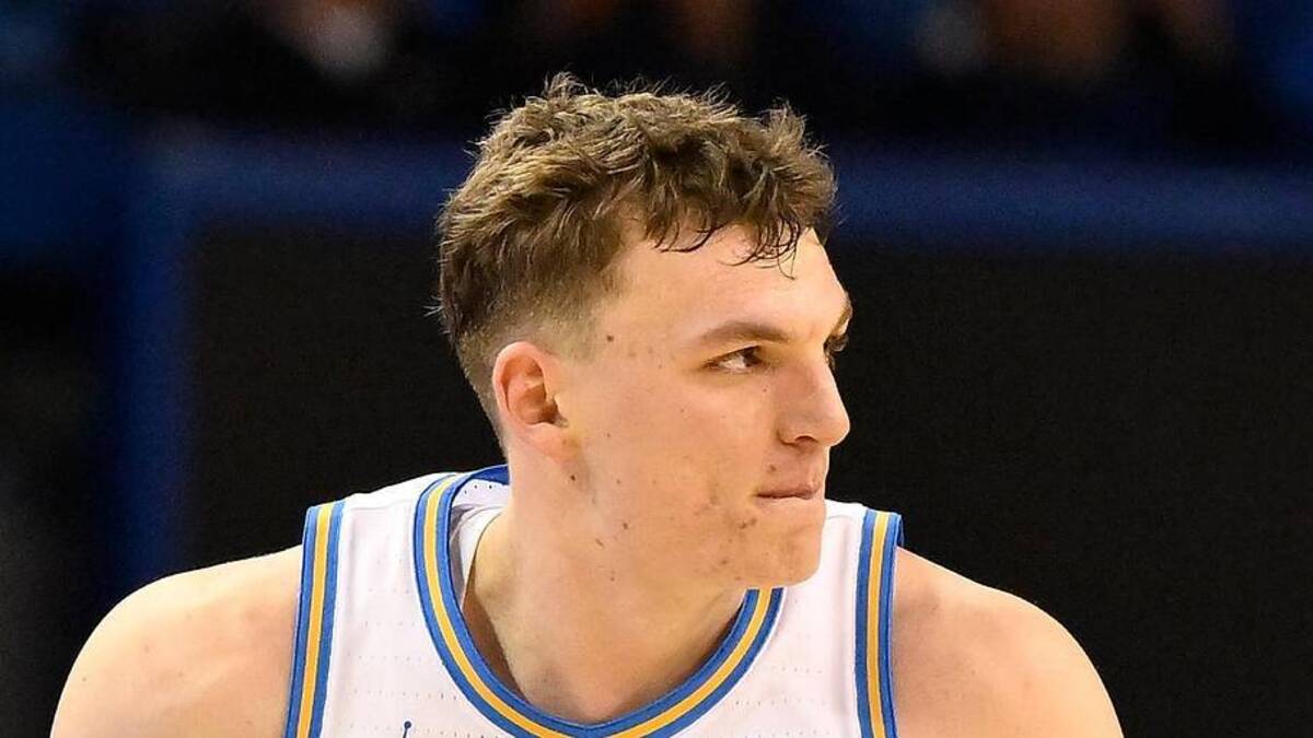  Feb 21, 2026; Los Angeles, California, USA; UCLA forward Tyler Bilodeau (34) runs back on defense after scoring a three-point basket during the second half against the Illinois Fighting Illini at Pauley Pavilion presented by Wescom Financial. Mandatory Credit: Robert Hanashiro-Imagn Images | Robert Hanashiro-Imagn Images 