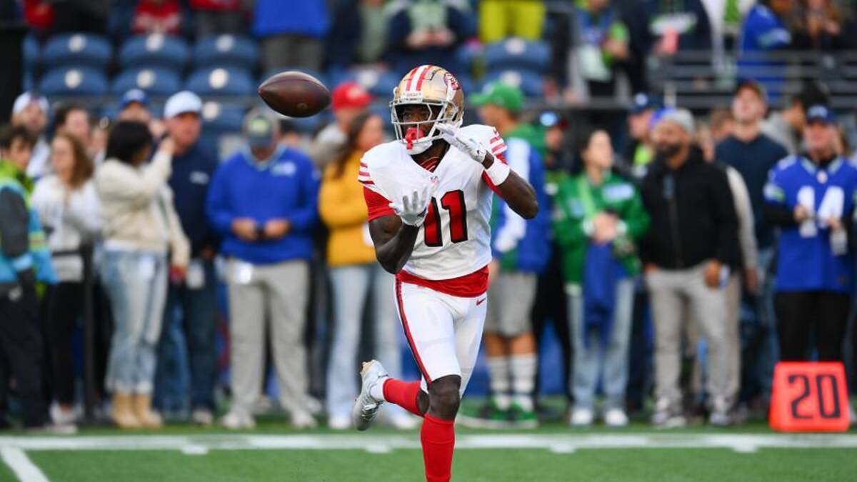  Oct 10, 2024; Seattle, Washington, USA; San Francisco 49ers wide receiver Brandon Aiyuk (11) catches the ball during warmups before the game against the Seattle Seahawks at Lumen Field. Mandatory Credit: Steven Bisig-Imagn Images | Steven Bisig-Imagn Images 