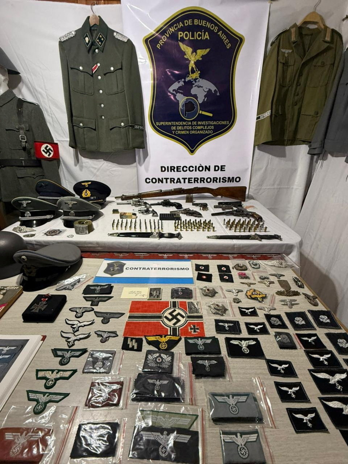 Nazi arsenal in this undated handout photo after Argentine police seized an arsenal of Nazi military uniforms, weapons, ammunition and accessories from a merchant in Buenos Aires province who was selling them online, according to a police statement, in Argentina. Policia de la Provincia de Buenos Aires/via REUTERS