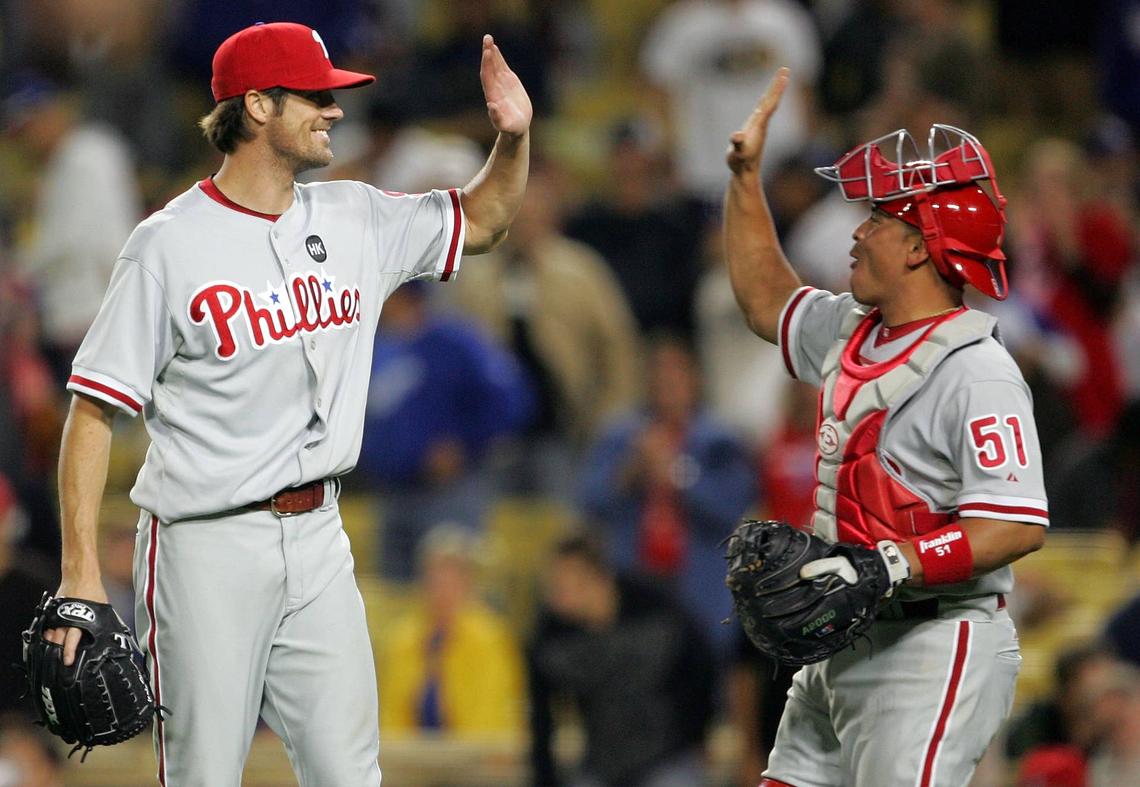  Philadelphia Phillies starting pitcher Cole Hamels and catcher Carlos Ruiz celebrate a victory against the Los Angeles Dodgers at Dodger Stadium. Gary A. Vasquez-USA TODAY Sports via Imagn Images