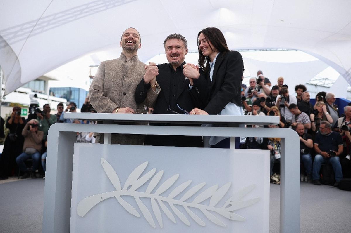 Director Cristian Mungiu and cast members Sebastian Stan and Renate Reinsve pose during a photocall for the film "Fjord" in competition at the 79th Cannes Film Festival in Cannes, France, May 19, 2026. REUTERS/Marko Djurica