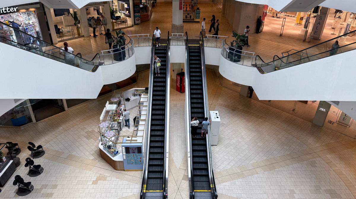 People walk around the Queens Center shopping mall in Queens, New York City, U.S., July 15, 2025. REUTERS/Kylie Cooper