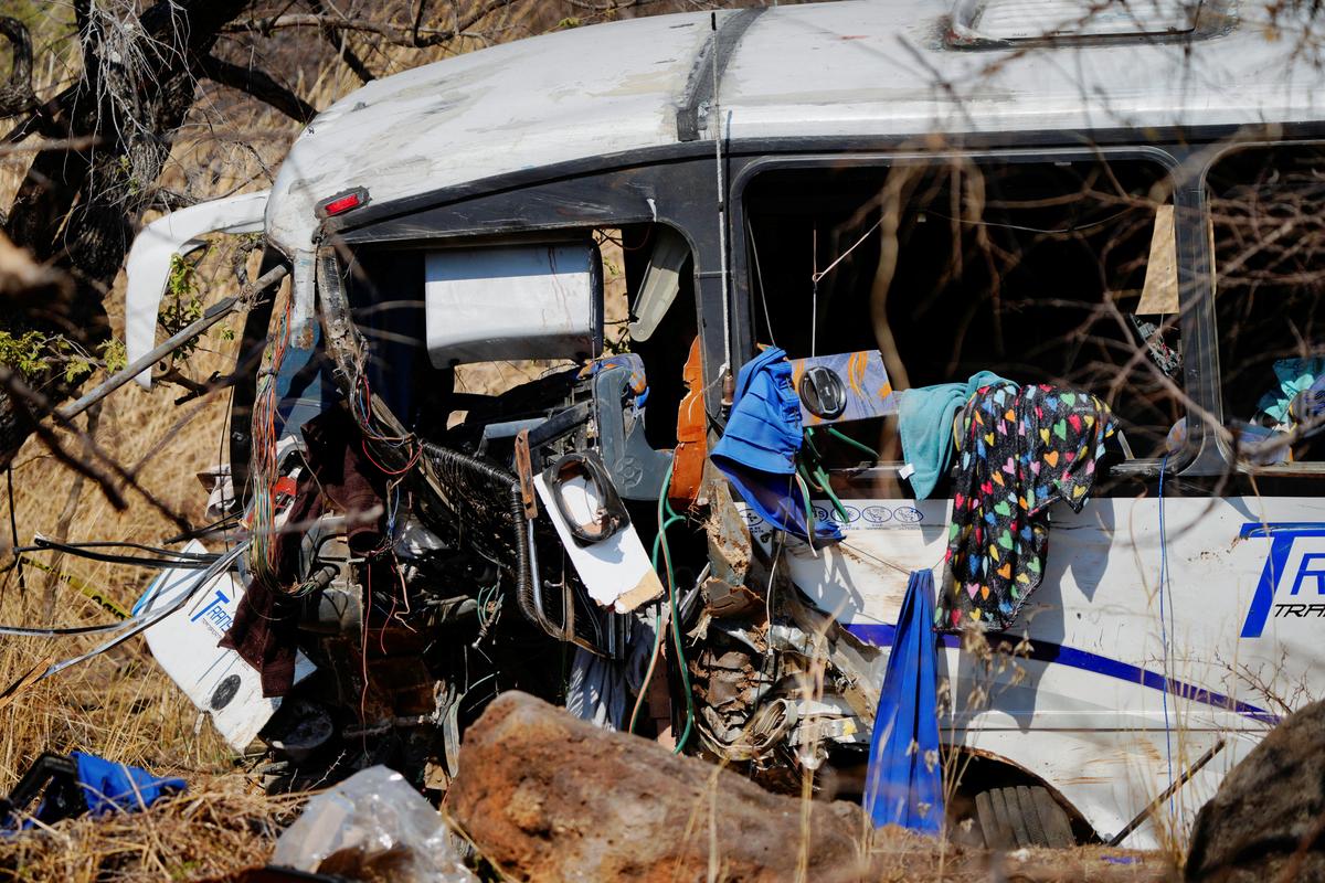 Passengers' belongings hang from the windows of the partially damaged bus at the site where a tourist bus overturned, killing several people and injuring others near the town of Amatlan de Canas, in the western state of Nayarit, Mexico, May 1, 2026. REUTERS/Christian Ruano