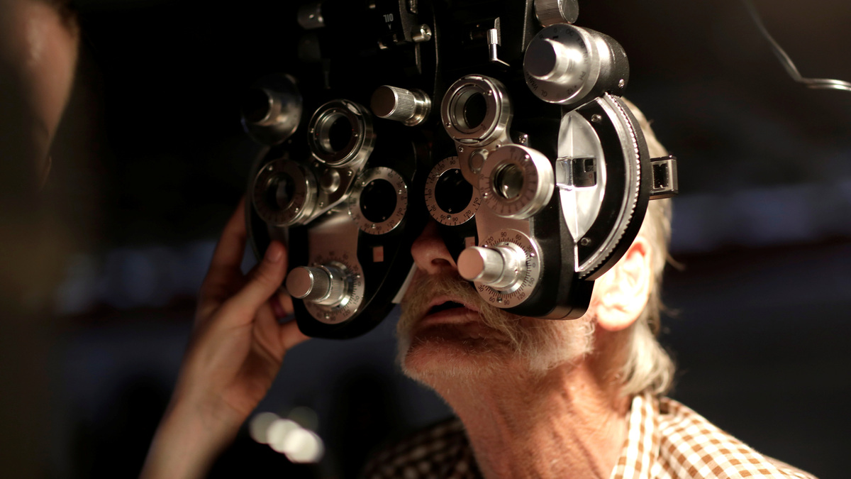 A man receives an eye exam at the Remote Area Medical Clinic in Wise, Virginia, U.S., July 22, 2017.   REUTERS/Joshua Roberts