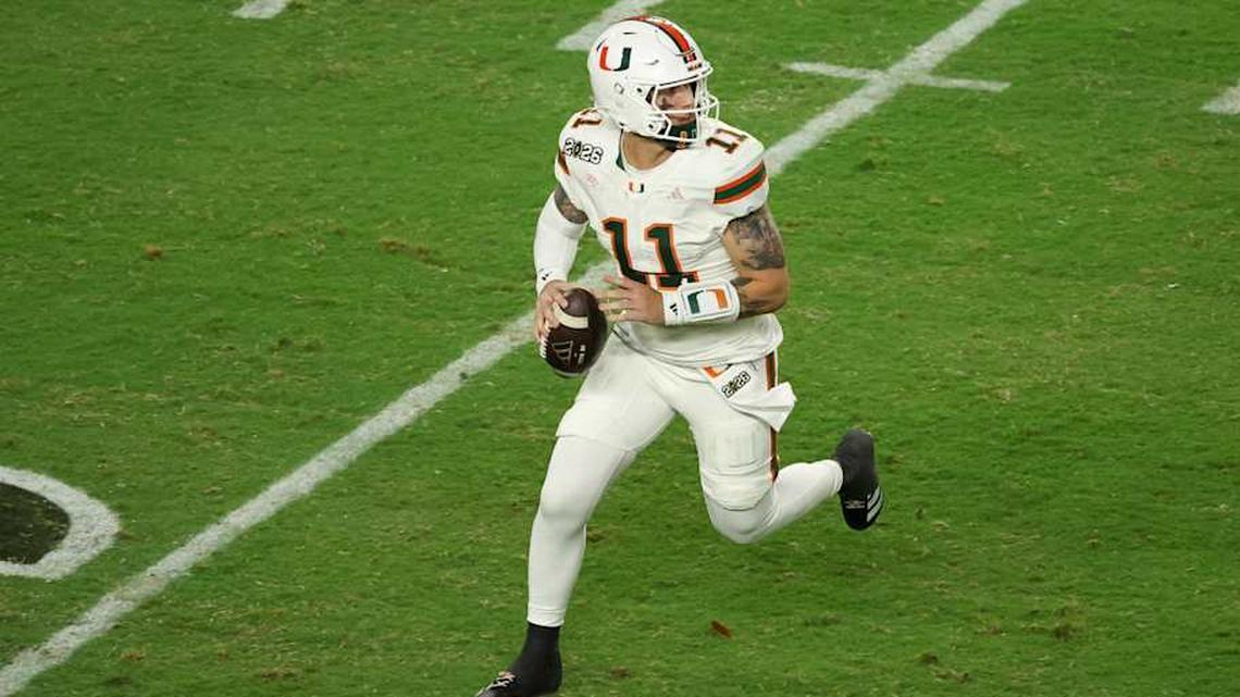  Jan 19, 2026; Miami Gardens, FL, USA; Miami Hurricanes quarterback Carson Beck (11) scrambles with the ball against the Indiana Hoosiers in the third quarter during the College Football Playoff National Championship game at Hard Rock Stadium. Mandatory Credit: Kim Klement Neitzel-Imagn Images | Kim Klement Neitzel-Imagn Images 