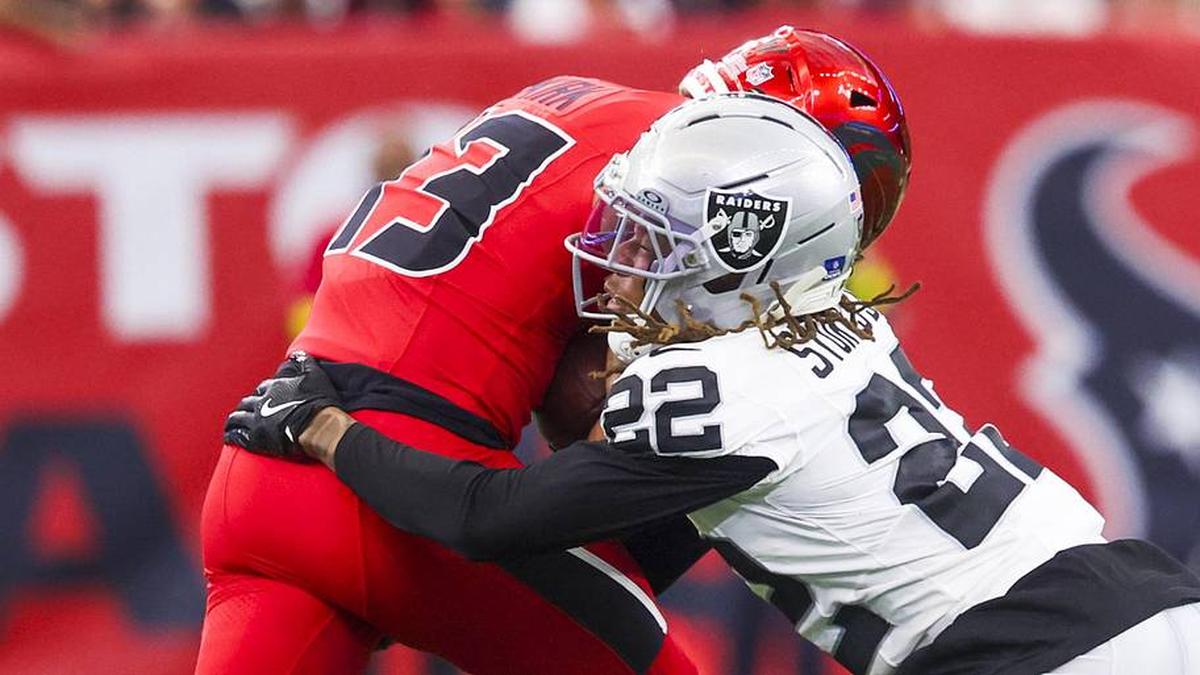  Dec 21, 2025; Houston, Texas, USA; Las Vegas Raiders cornerback Eric Stokes (22) tackles Houston Texans wide receiver Christian Kirk (13) during the second quarter at NRG Stadium. Mandatory Credit: Thomas Shea-Imagn Images | Thomas Shea-Imagn Images 