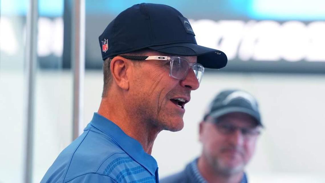  January 27, 2026; El Segundo, California, USA; Los Angeles Chargers coach Jim Harbaugh (left) and general manager Joe Hortiz attend introductory press conference for offensive coordinator Mike McDaniel at The Bolt. Mandatory Credit: Kirby Lee-Imagn Images | Kirby Lee-Imagn Images 