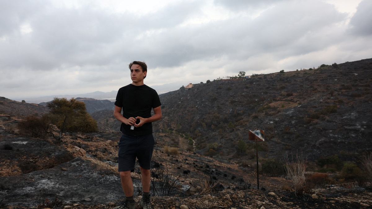 Thomas-Wolf Verdonckt observes the landscape where his father 63-year-old Stanislas Verdonckt was killed in deadly wildfires affecting Almeria province, in Bedar, Spain, July 11, 2026. REUTERS