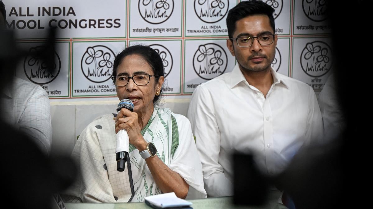 Chief Minister of West Bengal and Chairperson of All India Trinamool Congress Mamata Banerjee, left, addresses a press conference at her residence office in Kolkata on May 5, 2026, after her party lost the recently concluded state legislative assembly elections. Indian Prime Minister Narendra Modi's Bharatiya Janata Party (BJP) swept polls in the key eastern state of more than 100 million people, winning 206 of the 294 assembly seats, according to results announced April 4, for its first-ever victory in West Bengal. (Dibyangshu Sarkar/AFP/Getty Images/TNS)