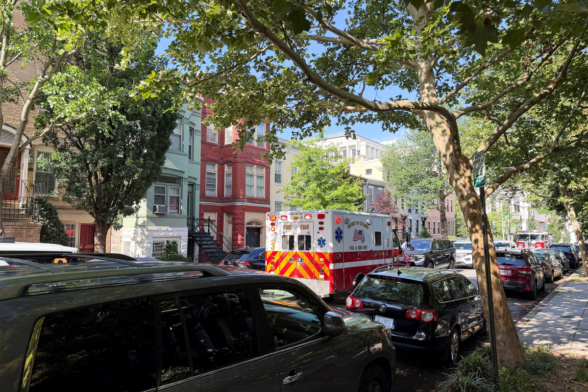 An ambulance is parked outside the home of Senator Mitch McConnell (R-KY) as police and fire vehicles block the street, on the morning when the Kentucky senator was reported to have been taken to the hospital in Washington, D.C., U.S. June 14, 2026. REUTERS/Bo Erickson