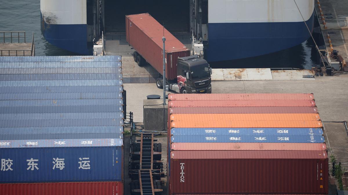 A truck unloads a shipping container at Pyeongtaek port in Pyeongtaek, South Korea, July 8, 2025.    REUTERS/Kim Hong-Ji
