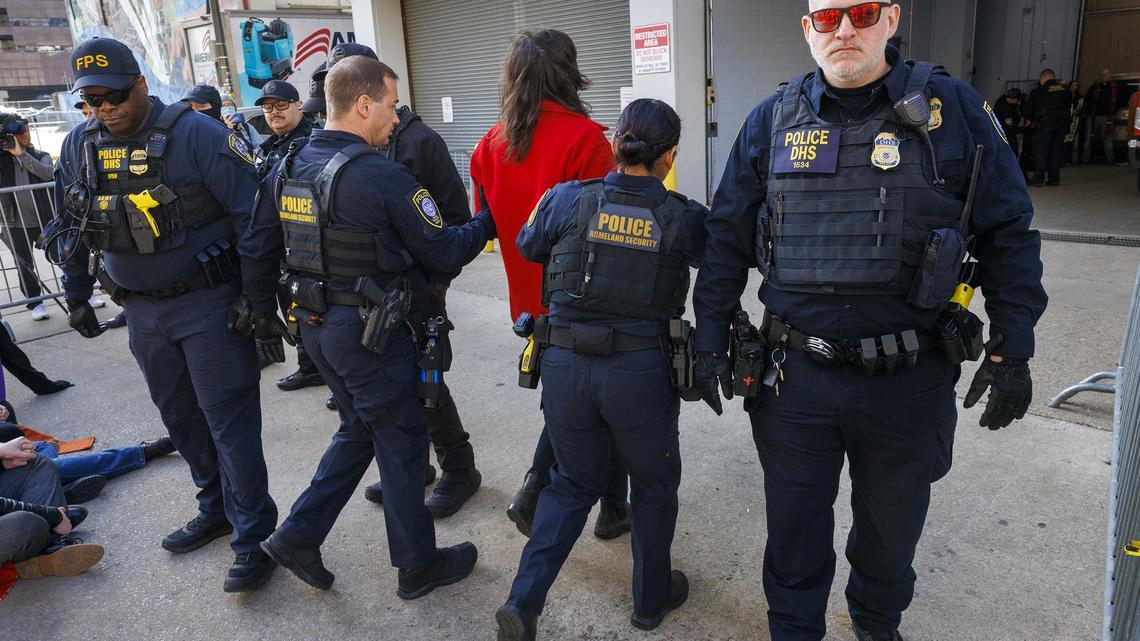 Carrie Rathmann of West Philadelphia gets arrested by officers with the U.S Department of Homeland Security during a protest outside the Philadelphia Immigration and Customs Enforcement office in March. (Alejandro A Alvarez/The Philadelphia Inquirer/TNS)