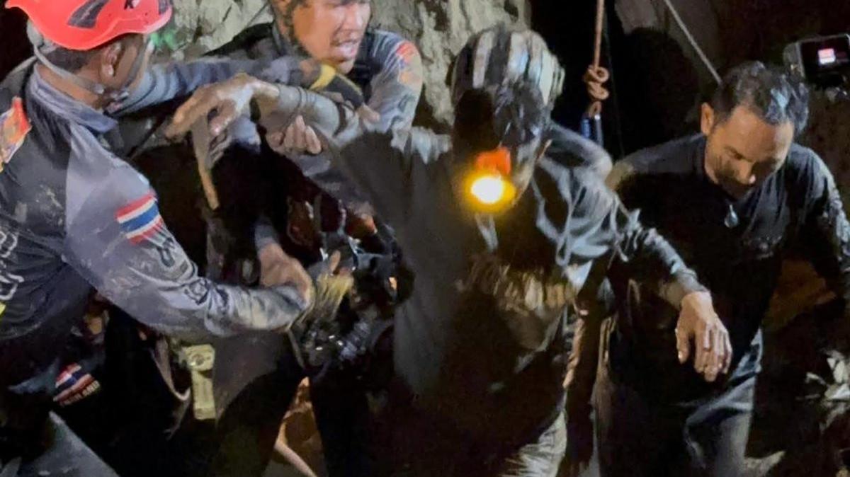 The first Laotian survivor is rescued from a flooded cave in a mountainous area in Xaysomboun province, Laos, Friday. On Saturday, the other four men were able to walk and crawl out of the cave on their own after waters receded. Two men are still missing. Photo by Metta Tham Kalasin Rescue/EPA